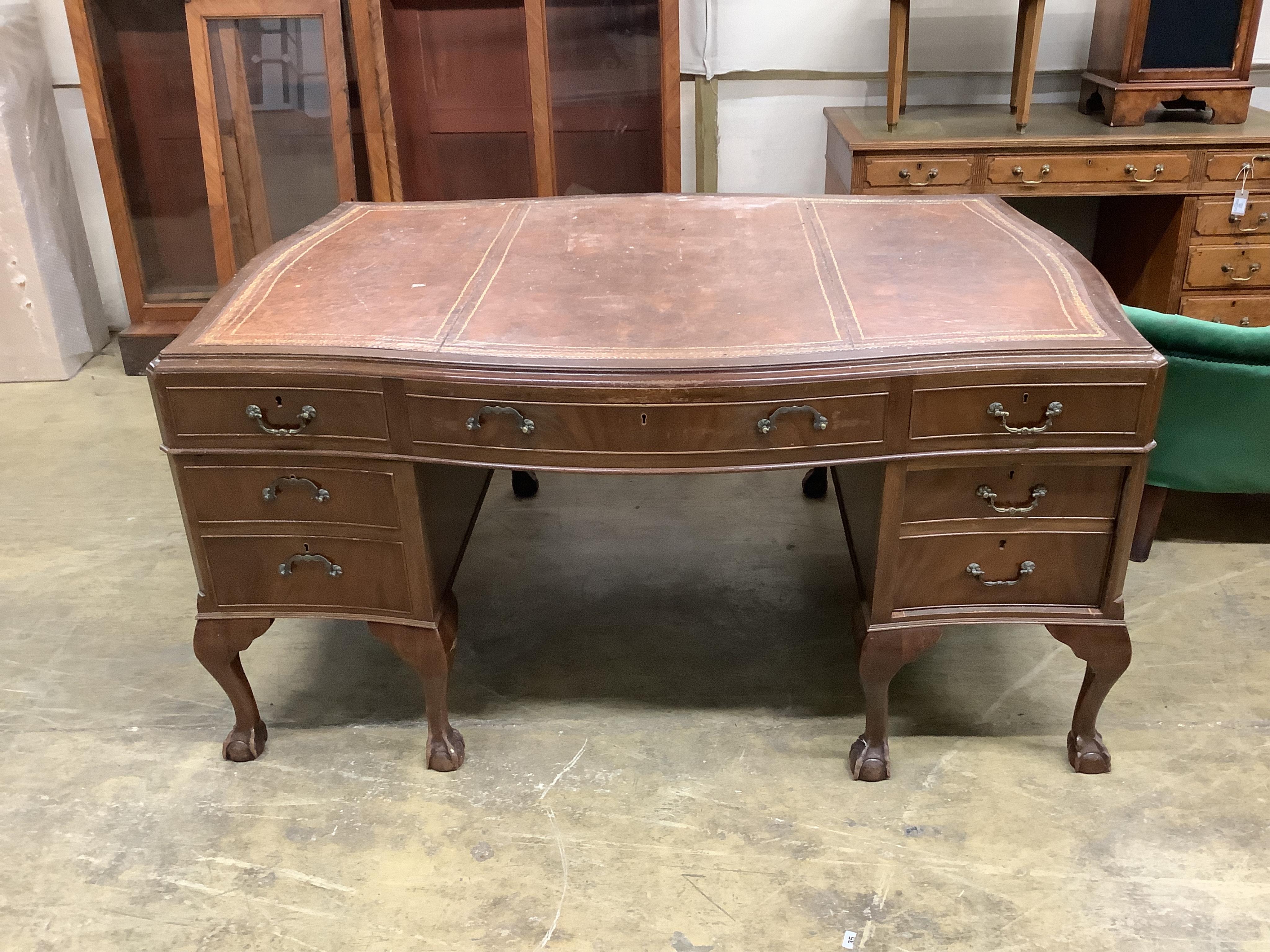 A Chippendale Revival mahogany serpentine partner's kneehole writing desk, width 152cm, depth 118cm, height 77cm. Condition - fair